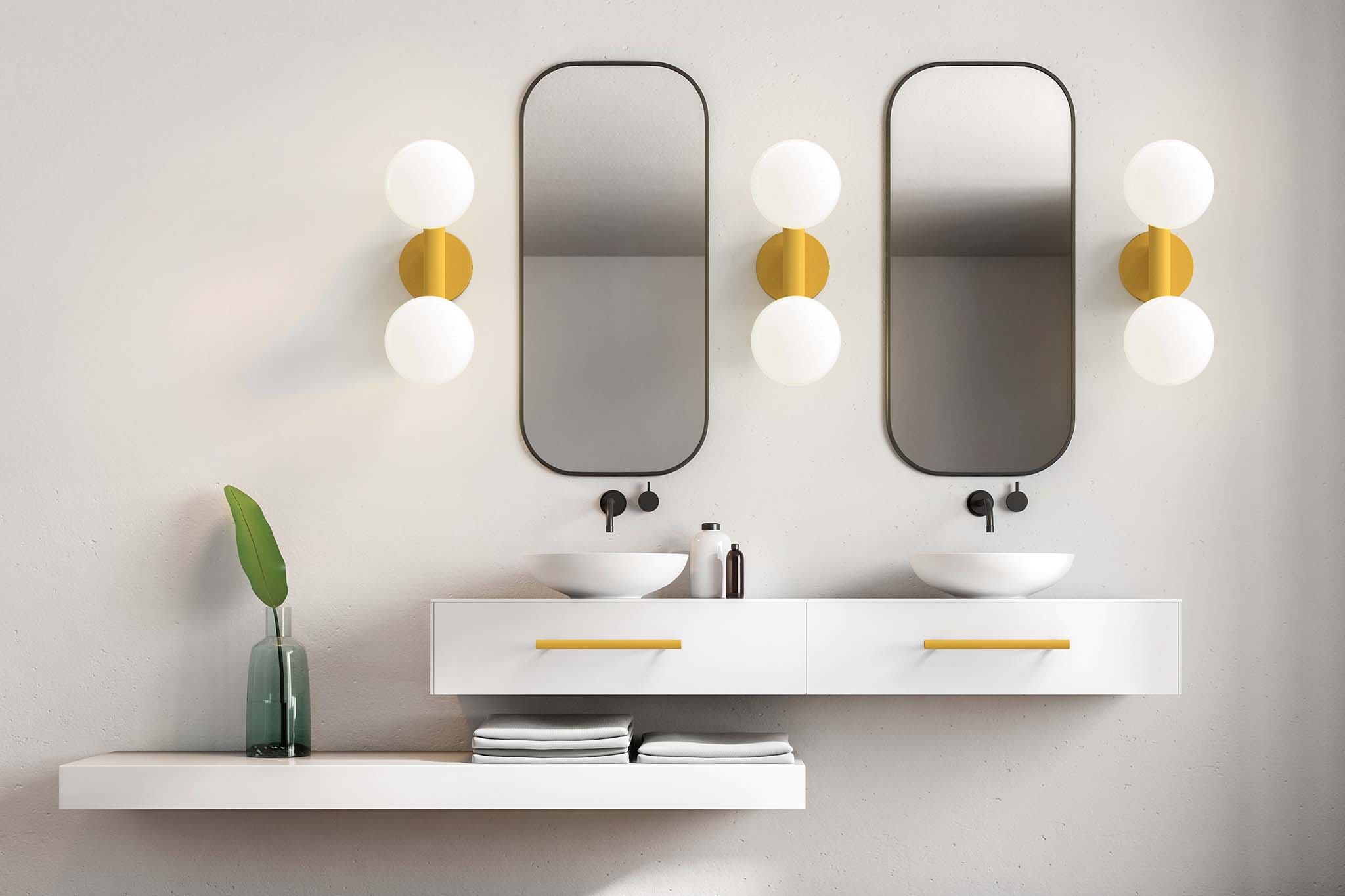 Dutton Brown ochre sconces and swift pulls in a bathroom vanity setting